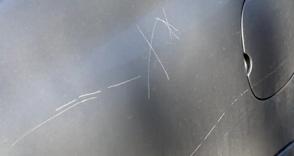 Isolated Scratch on Sedan Door