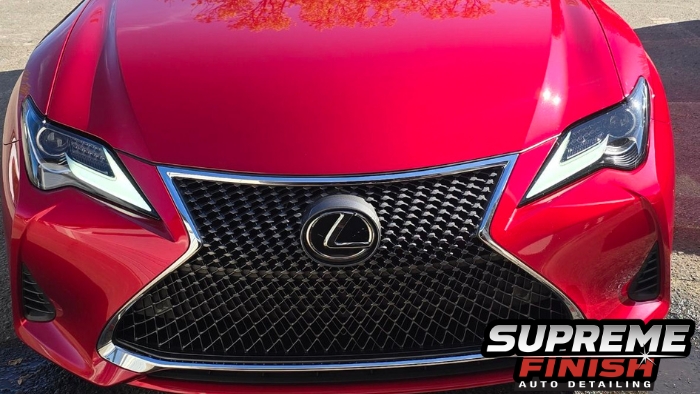 Front grille of a red Lexus RC 350 F Sport after System-X ceramic coating at Supreme Finish Auto Detailing in Raleigh